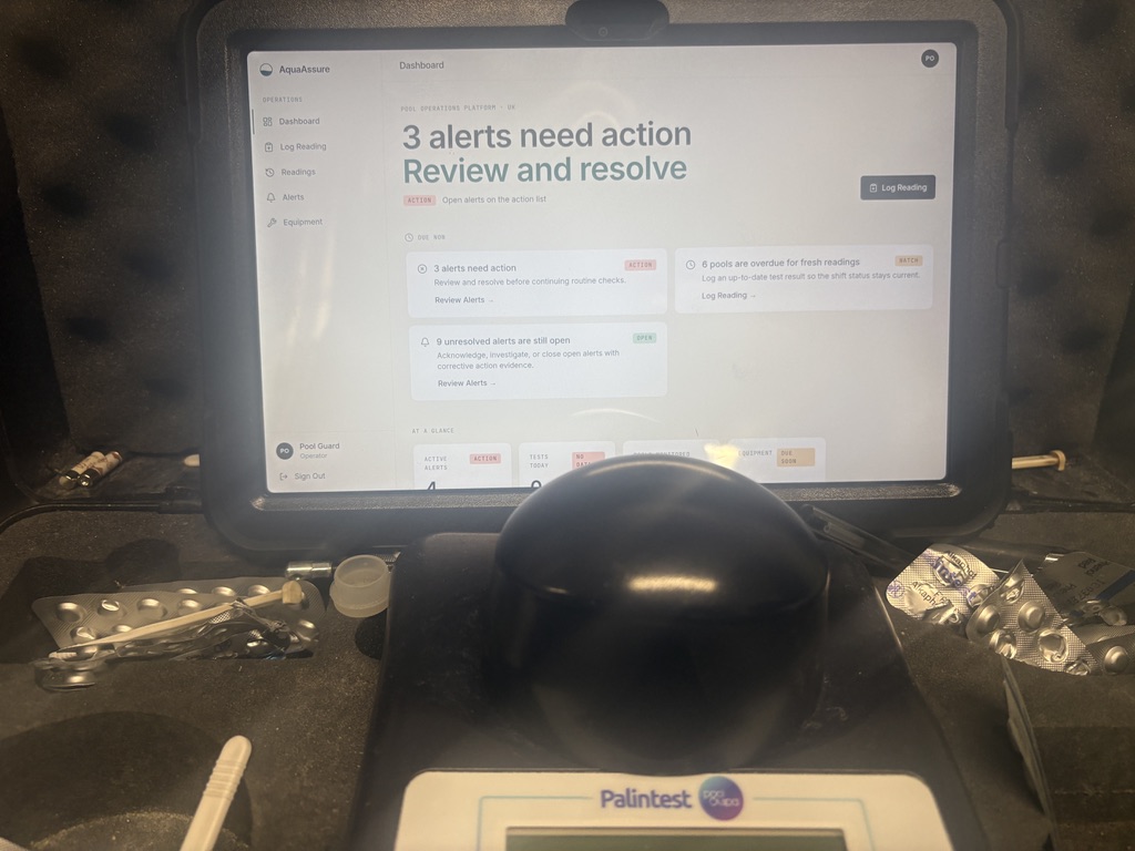 AquaAssure pool compliance dashboard showing water quality alerts on a tablet in a plant room
